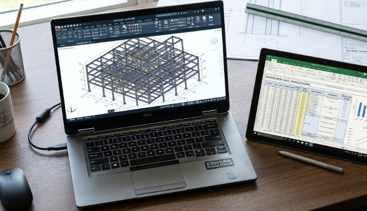 A high-performance laptop showing the laptop requirements for structural design by running AutoCAD and RCC spreadsheets.