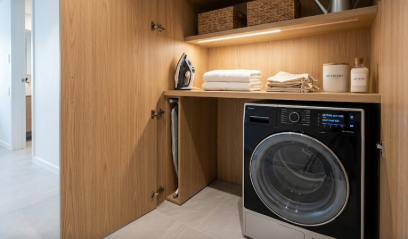 A compact laundry closet featuring modern Ventless Heat-Pump Dryers for a rental apartment.
