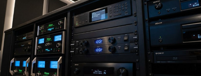  A high-end home theater rack featuring a premium unit that provides Furman Symmetrical Power Filtration.