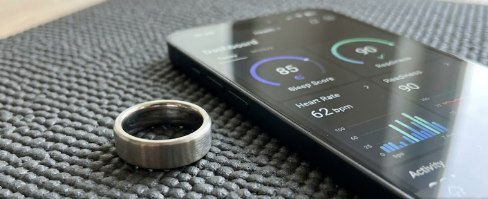 A sleek titanium fitness tracker on a mat, representing our comprehensive smart ring buying guide.
